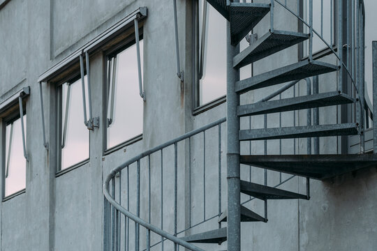 A structured architecture scene where a staircase contrasts with geometry inside a rigid framework shaped by urban metal detail and emphasizing modern symmetry under clear minimal design aspects