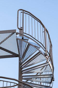 Contemporary architecture presenting a staircase aligned with geometry along a layered structure where urban metal detail reinforces modern symmetry expressed through refined minimal design