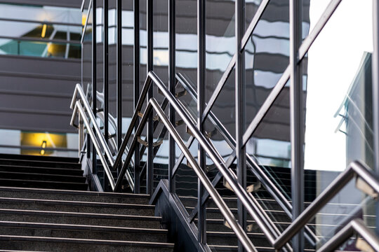 A refined architecture view where a staircase intersects with geometry inside a structured urban setting shaped by metal detail and modern symmetry under minimal design principles
