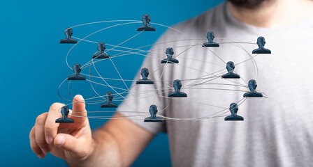 Person points to a network connection concept. Illustrating communication, teamwork, and global connections. Highlighting collaboration and digi