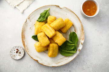 Fish nuggets with fresh spinach