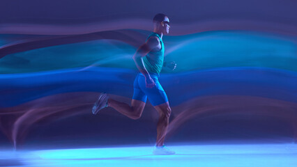 Runner in neon studio colors sprinting across glowing motion trails. Concept of athletic performance visuals, cardio training content, running gear promotion, and speed-focused fitness campaigns.