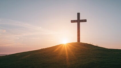 Serene Sunset Behind Wooden Cross on Hilltop Landscape