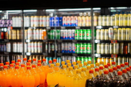Colorful Bottled and Canned Drinks in Store Aisle