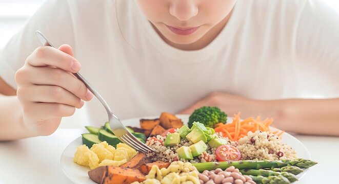 Close up of a person eating a healthy vibrant bowl of fresh vegetables and grains - Powered by Adobe