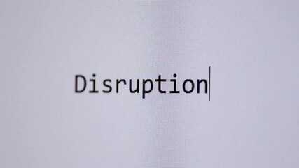 The word “Disruption.” appears as if typed letter by letter on a clean white digital screen, symbolising innovation, change, transformation, technology shifts, and modern business disruption