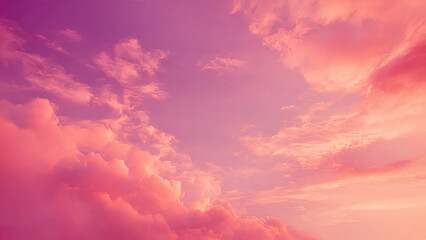 A beautiful, vibrant sky painted with soft, fluffy clouds in breathtaking shades of pink, coral, and purple, creating a serene and dreamy atmosphere.