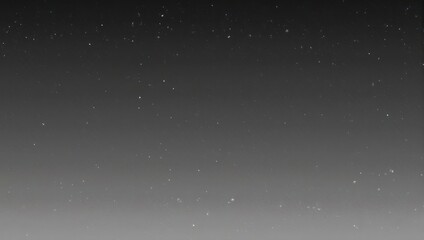 Obraz premium Abstract Grayscale Gradient Background with Subtle Speckles.