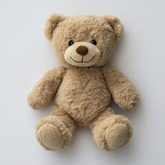 Obraz premium Fluffy brown teddy bear with soft texture and warm smile sitting on plain white background, evoking comfort and childhood nostalgia