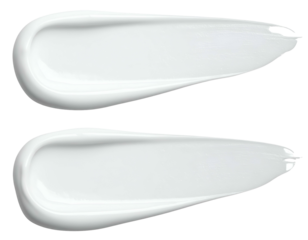 Two white cosmetic product swatches with creamy texture, on black