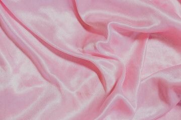 pink silk fabric background with folds