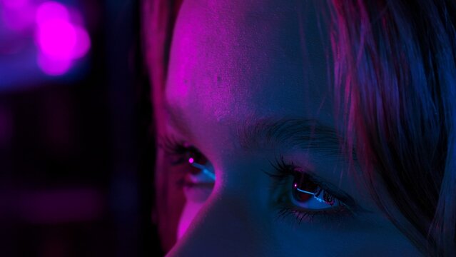Close up of woman face in neon lights
