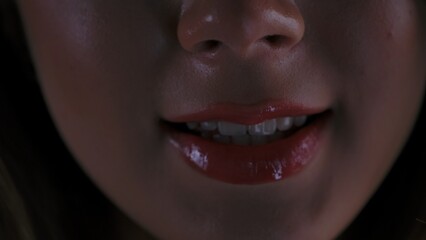 Close up of Woman Lips with Glossy Red Lipstick