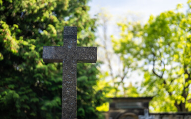 Memorial stone cross in the forest cemetery.