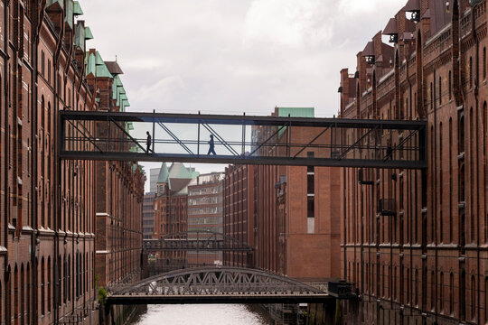 speicherstadt in hamburg featuring canal framing and waterway detail around brick architecture, forming a cohesive urban historic district enhanced by subtle evening light perspective