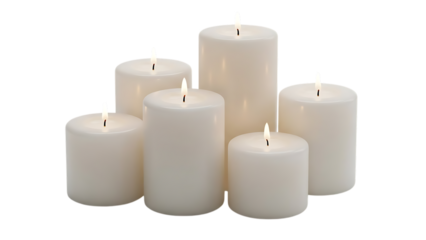 Six white pillar candles of varying heights with lit wicks arranged closely together, cutout, PNG isolated on transparent background