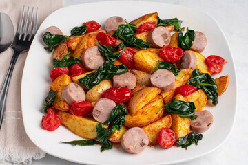 sauteed tomatoes and spinach  with chicken  sausage