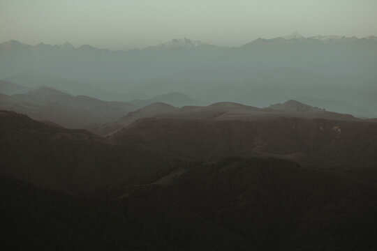 Natural landscape with dark mountains. Low-contrast background.