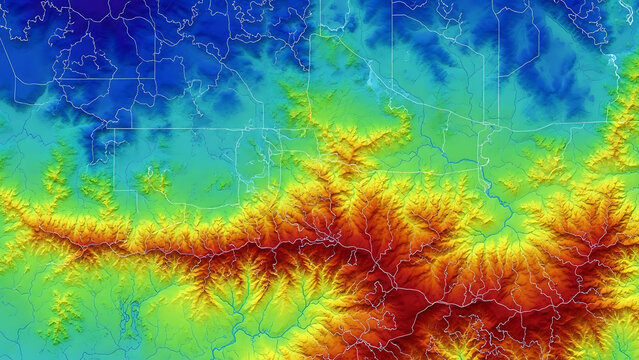 Digital topographic relief map showcasing land elevation data with a vibrant color gradient and overlaid boundaries