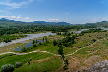 Fototapeta premium Mtkvari river valley and fields viewed from Uplistsikhe