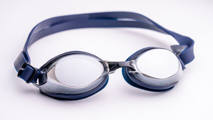 Blue swimming goggles with polarized coating and mirrored surface. Glasses for athletes swimming in the pool. High quality photo