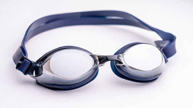 Blue swimming goggles with polarized coating and mirrored surface. Glasses for athletes swimming in the pool. High quality photo