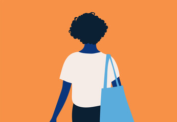 Rear view of a person with curly hair carrying a blue tote bag on an orange background.