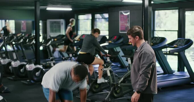 Friends, weightlifting and handshake in gym for fitness, workout and exercise motivation together. Men, personal trainer and barbell with hug for sports, training and wellness or goals in health club