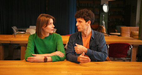 Young couple filming blog or video call looking at camera