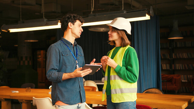Project manager and female engineer shaking hands in modern office - Powered by Adobe