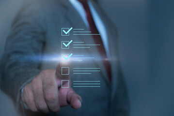 Businessmen mark checklist on a touch screen with a futuristic and innovative approach to task management. Digital file checklist, document management online