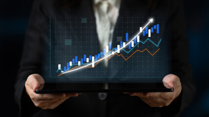 A business professional displays a tablet featuring a financial growth chart and graphs, symbolizing innovative data analysis, success, and economic progress in a modern setting. Impute