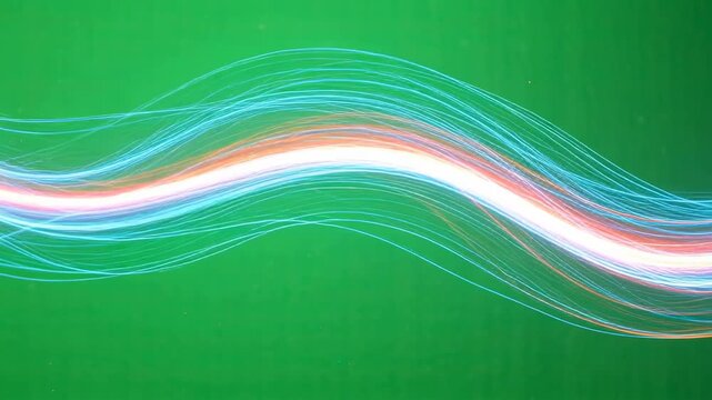 Glowing light trail wave neon line flowing with motion energy. colorful light streak and long exposure green background evoking vibrant blue pink