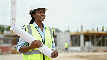 Black female construction engineer with blueprints — diversity & hiring