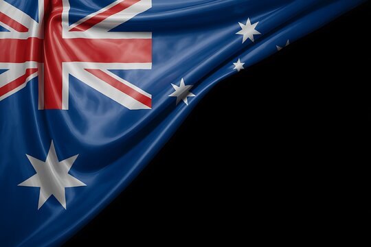 Australian flag waving with dramatic lighting and dark background for text overlay