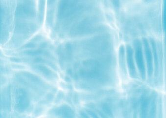 The surface of the water is clear and blue with ripples