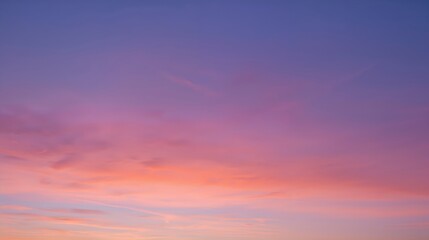 Obraz premium A vibrant sunset sky with hues of purple, pink and orange. This captivating scene offers a sense of peace and tranquility