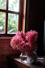 Pink Dahlia Flowers in Vase with Knitted Wool Mouse by a Wooden Window in Dalat, Vietnam