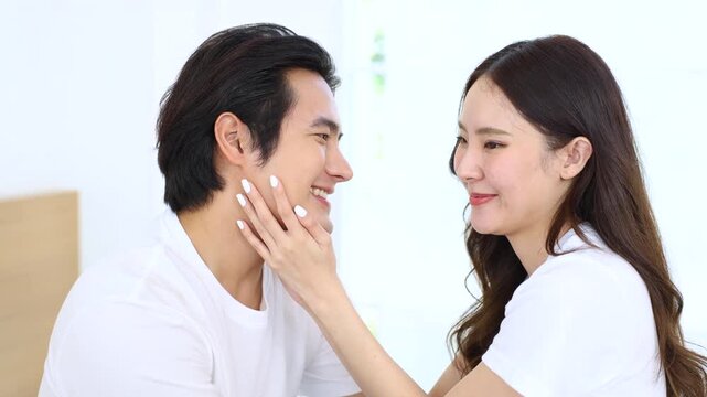 A happy relationship in a close relationship of a couple.Love expressed through romantic intimacy. A young man and woman tenderly care for each other. Asian lifestyle of embracing with sweet feelings.