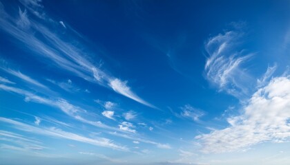bright blue sky with wispy clouds on a clear day