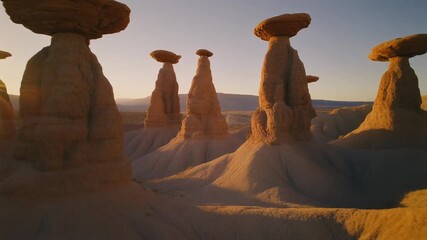 Stunning desert landscape with unique rock formations at sunrise, a captivating travel destination inspiring adventure and exploration in nature's beauty - Powered by Adobe