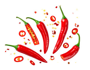 Vibrant red chili peppers, whole, sliced, and flakes, on black
