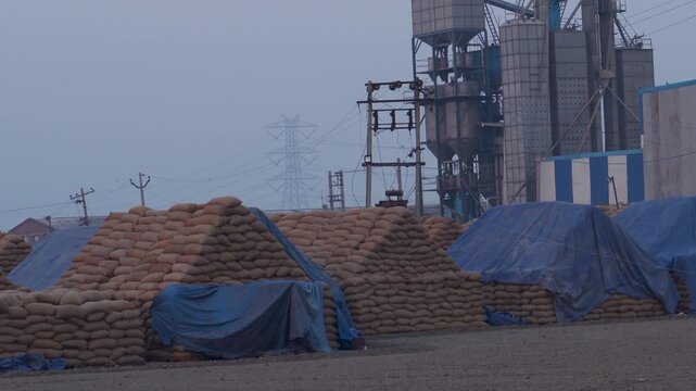 Packed rice paddy bags stored in Karnal Haryana godown after harvesting season marking end of Kharif season. India