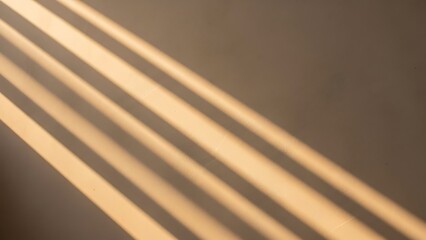 Sunlight stripes casting shadows on a beige wall, creating a serene and warm atmosphere.