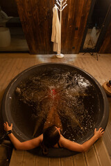 Relaxing evening in a hot tub by a cozy cabin