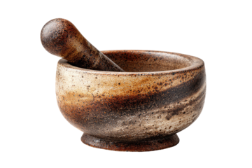 A weathered, speckled ceramic mortar and pestle sits isolated on a black background