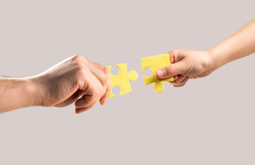 Hands connecting puzzle. Solution of problems. Mens and childs hands connecting puzzles