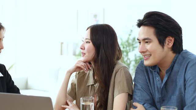 Couple discussing financial decision with realtor advisor about property insurance, agreement terms, mortgage document sign confident client planning homeownership, credit approval, family lifestyle