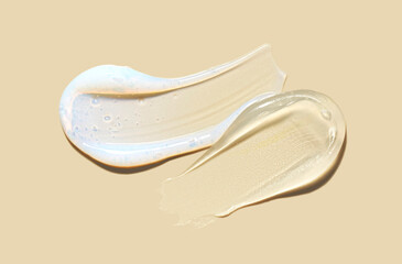 Set of two beauty products serum, mask or emulsion smudges on creamy yellow background. Beauty...