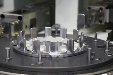 Electric motor stator coil winding machine with a view of its working station. Slot of stator copper winder device